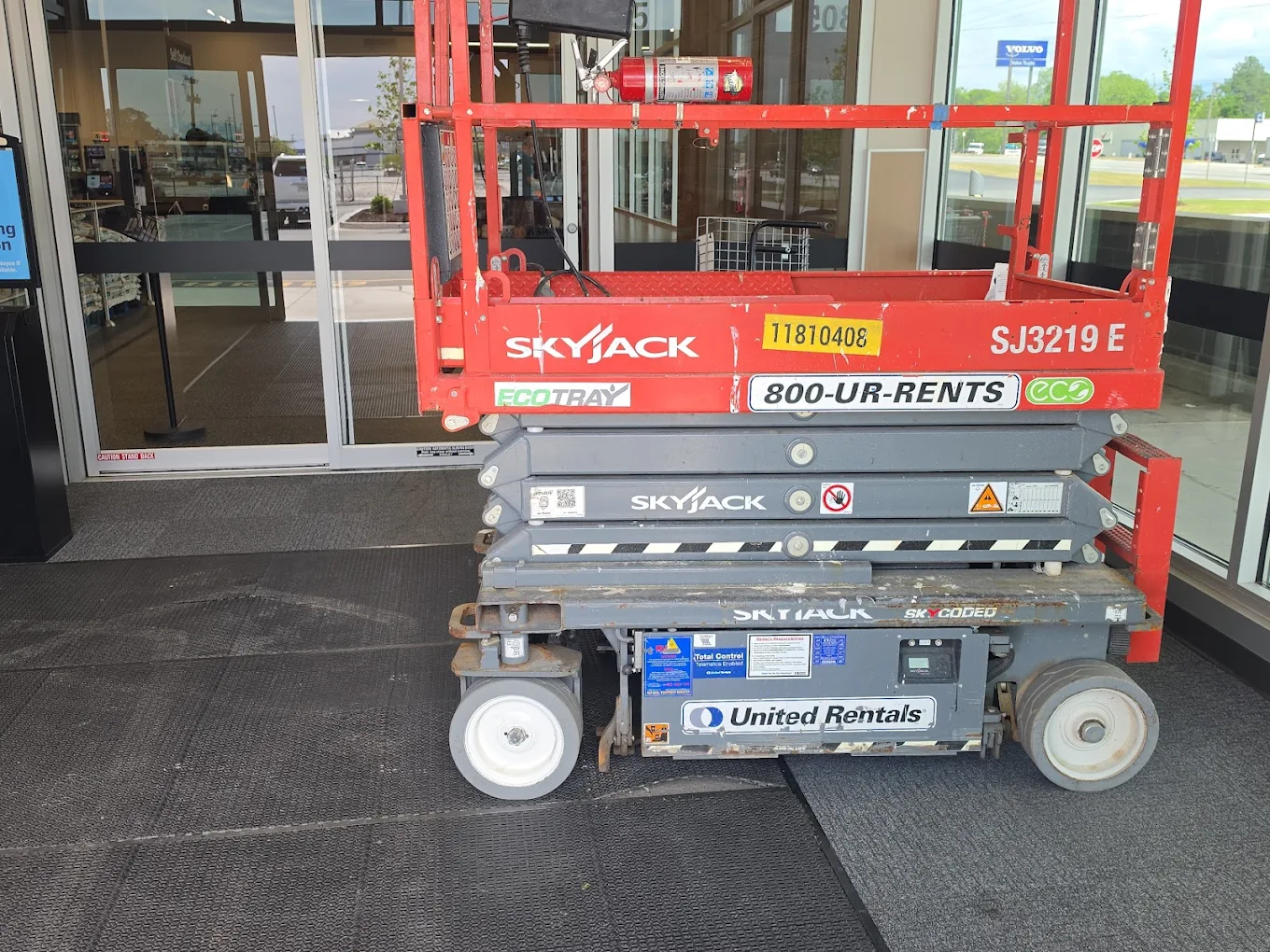 Scissor lift on a commercial storefront job — Fulford Construction